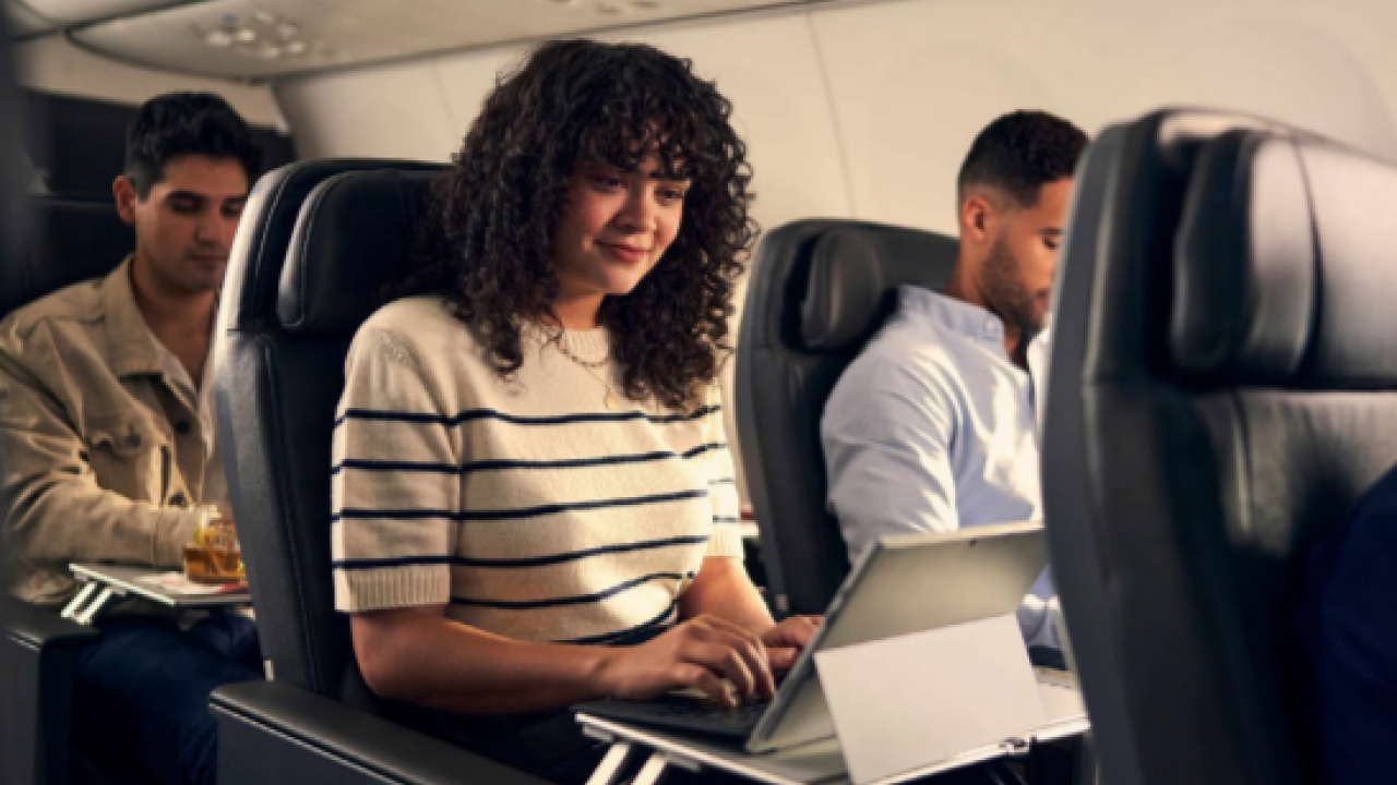 People seated on an airplane.