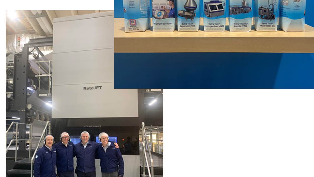 A group of four people in front of a large machine and a picture of cartons of milk.