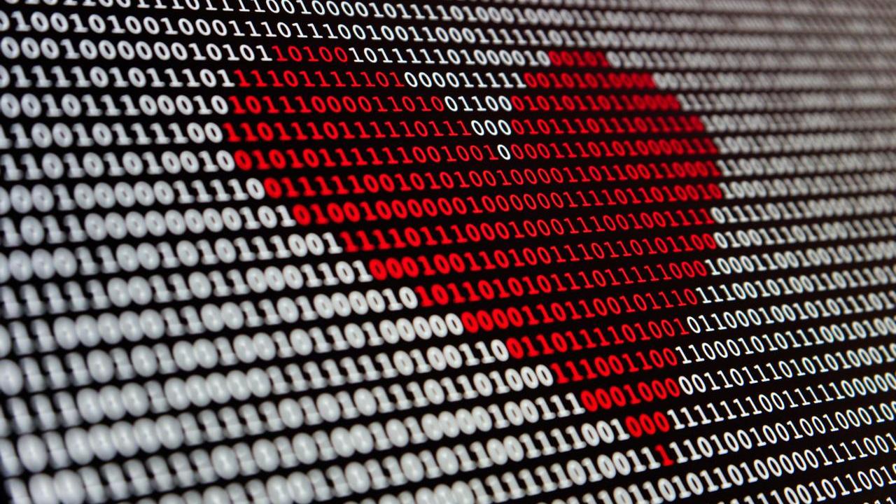 numbers on a screen with a red love heart in the middle
