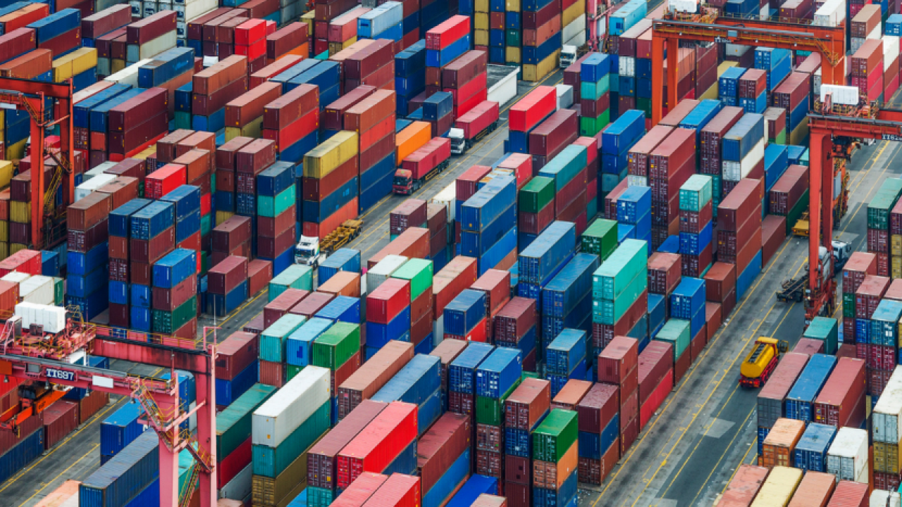 Large shipping facility with hundreds of stacked shipping containers