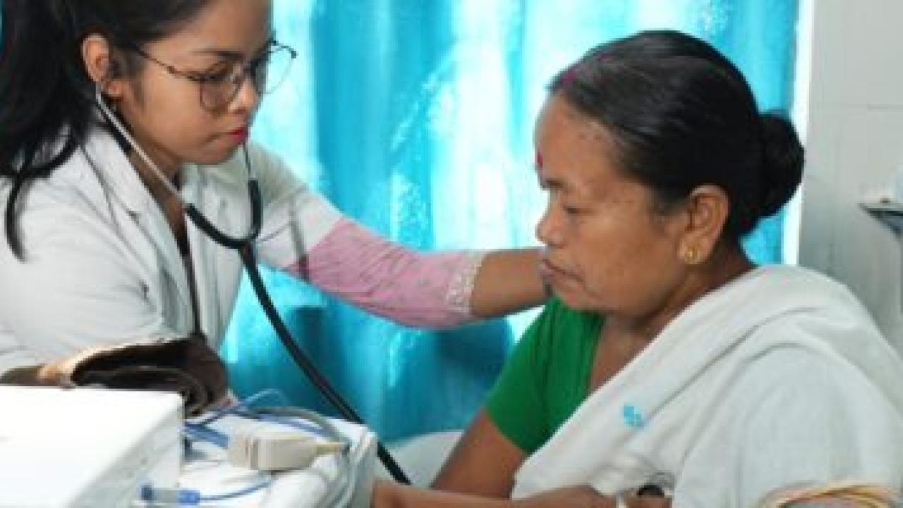 Healthcare worker attending to a patient
