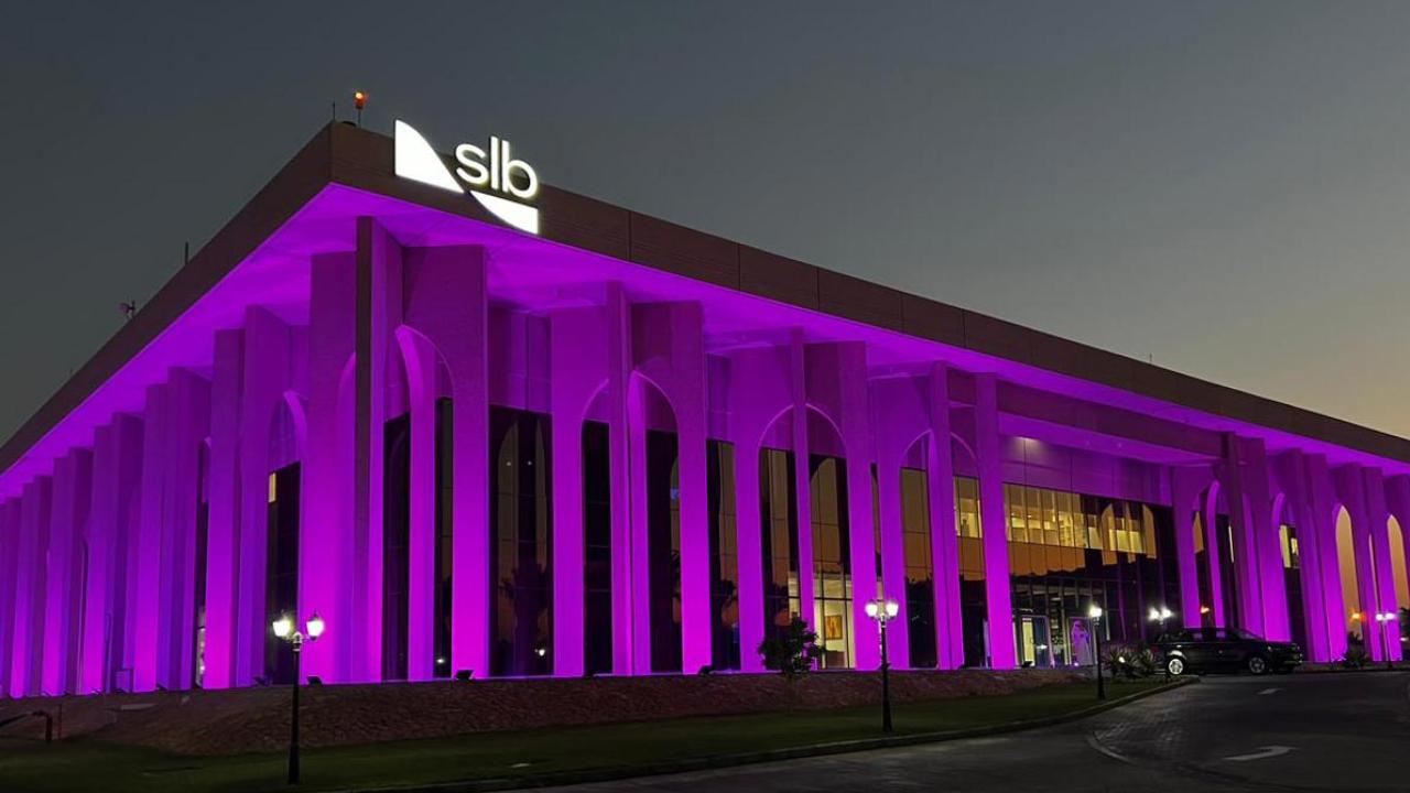 slb building lit up in purple