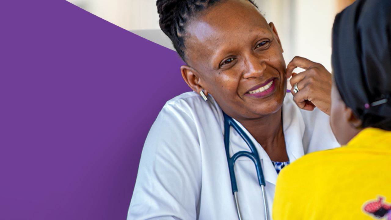 A doctor smiling at a patient