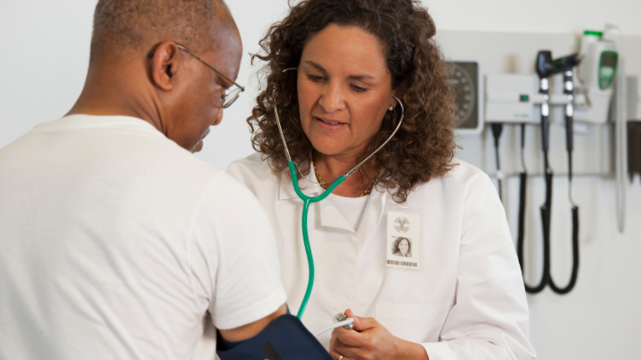 Doctor taking a patients blood pressure
