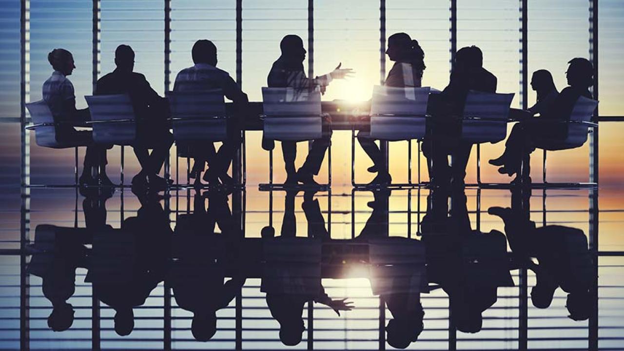 group of people sitting at table