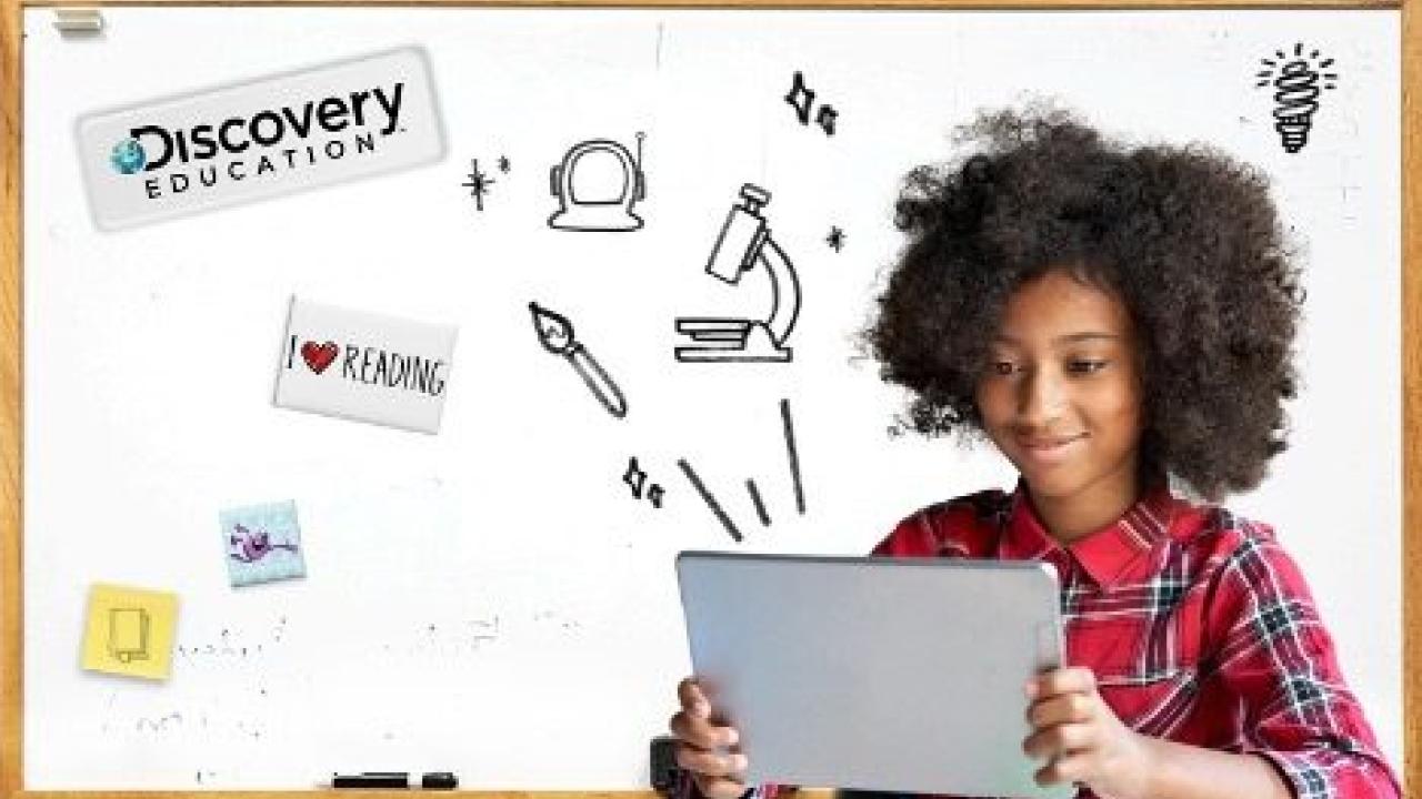 A child looking at a tablet, with various graphic icons
