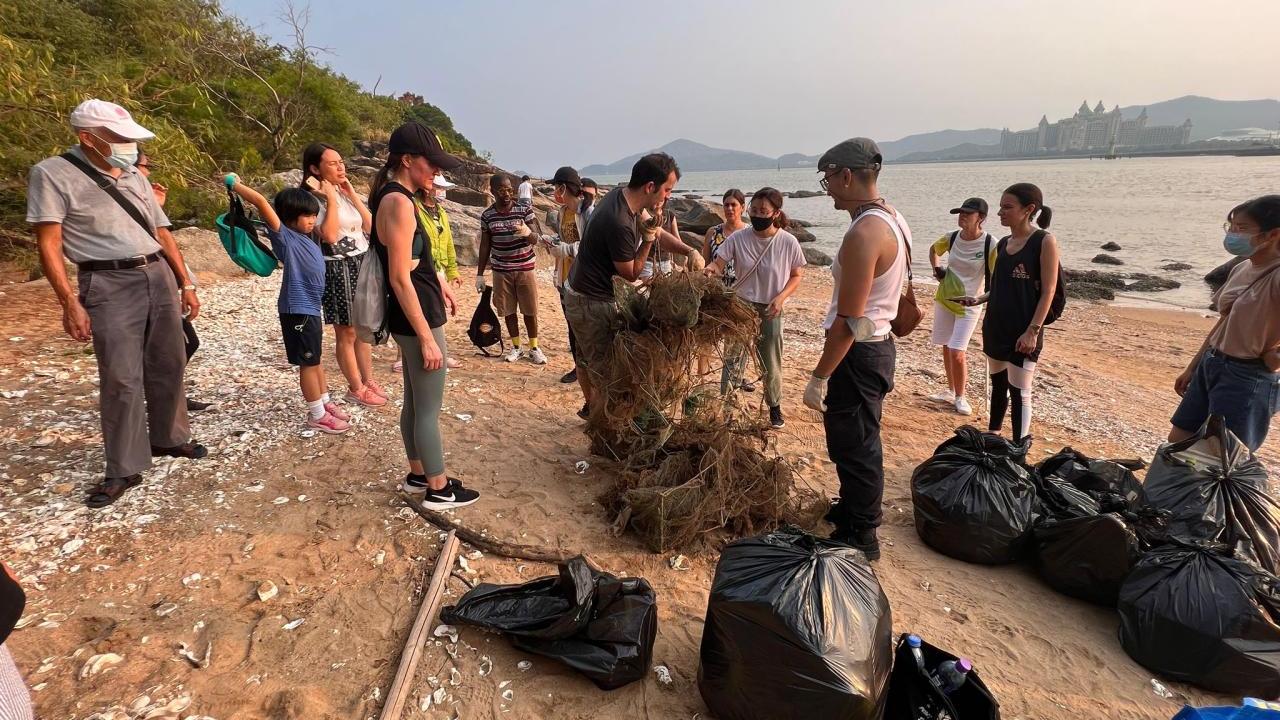 People cleaning up a beach