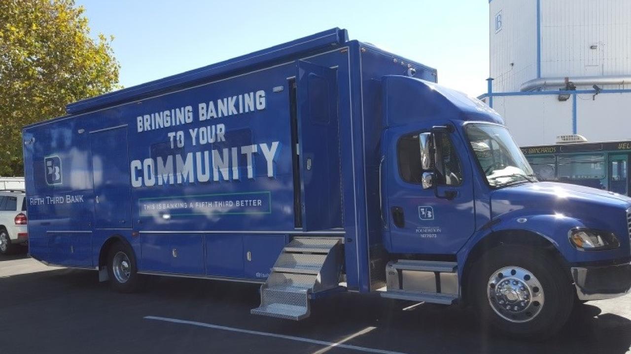 Picture of bus that says, "Bringing Banking to Your Community" on the side