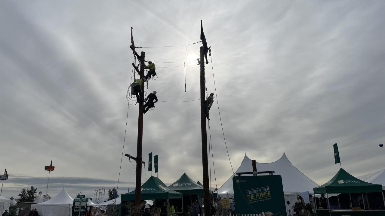 two power line poles on display at the world ag expo