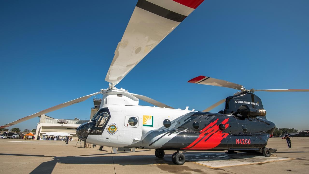 A helicopter and heli-tanker on the ground