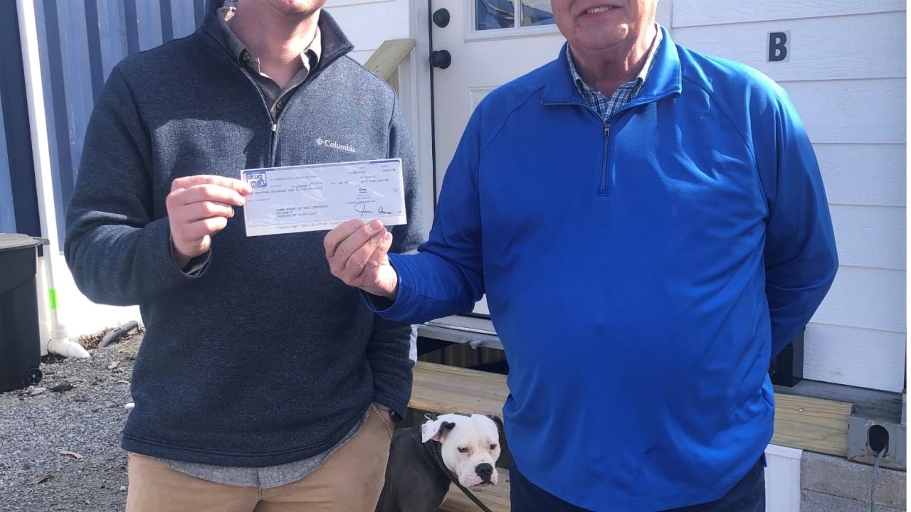 Receiving donation check