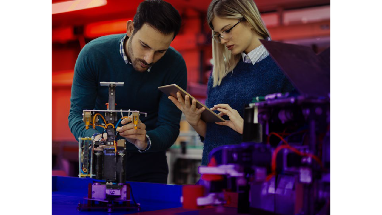 Two people working on a project together
