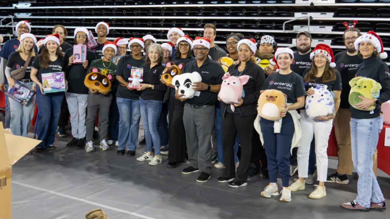A group of people standing with toys