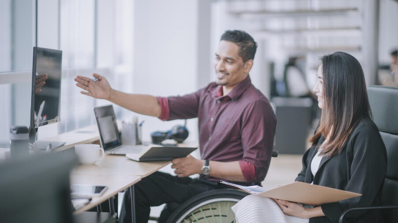 Employee in a wheelchair in an office