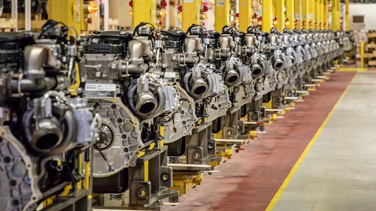 A neat row of Engines in a manufacturing setting.