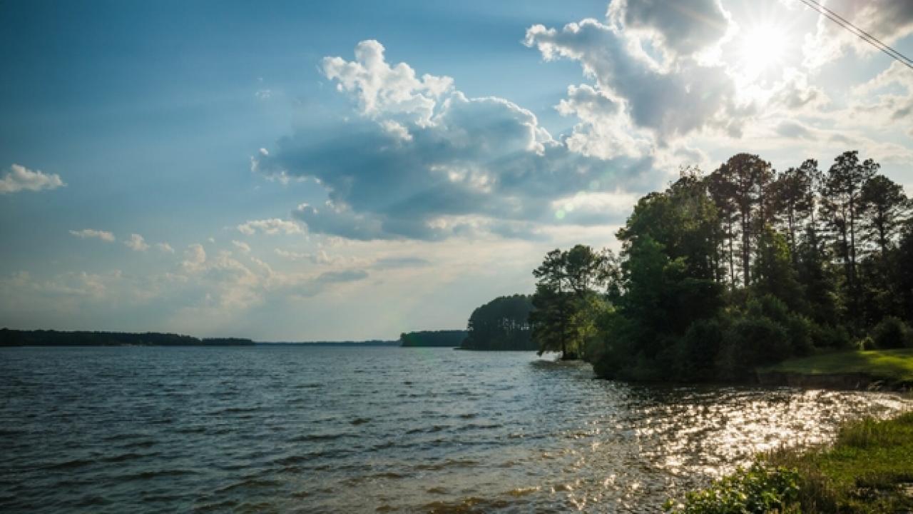 Sun shining over island landscape