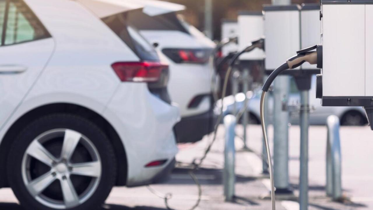 An electric vehicle being charged