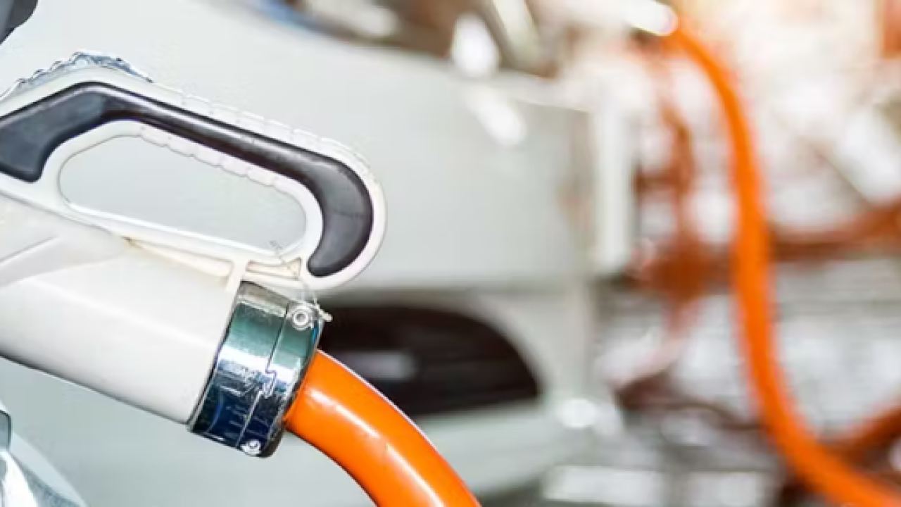 Close up of an electric vehicle plugged in