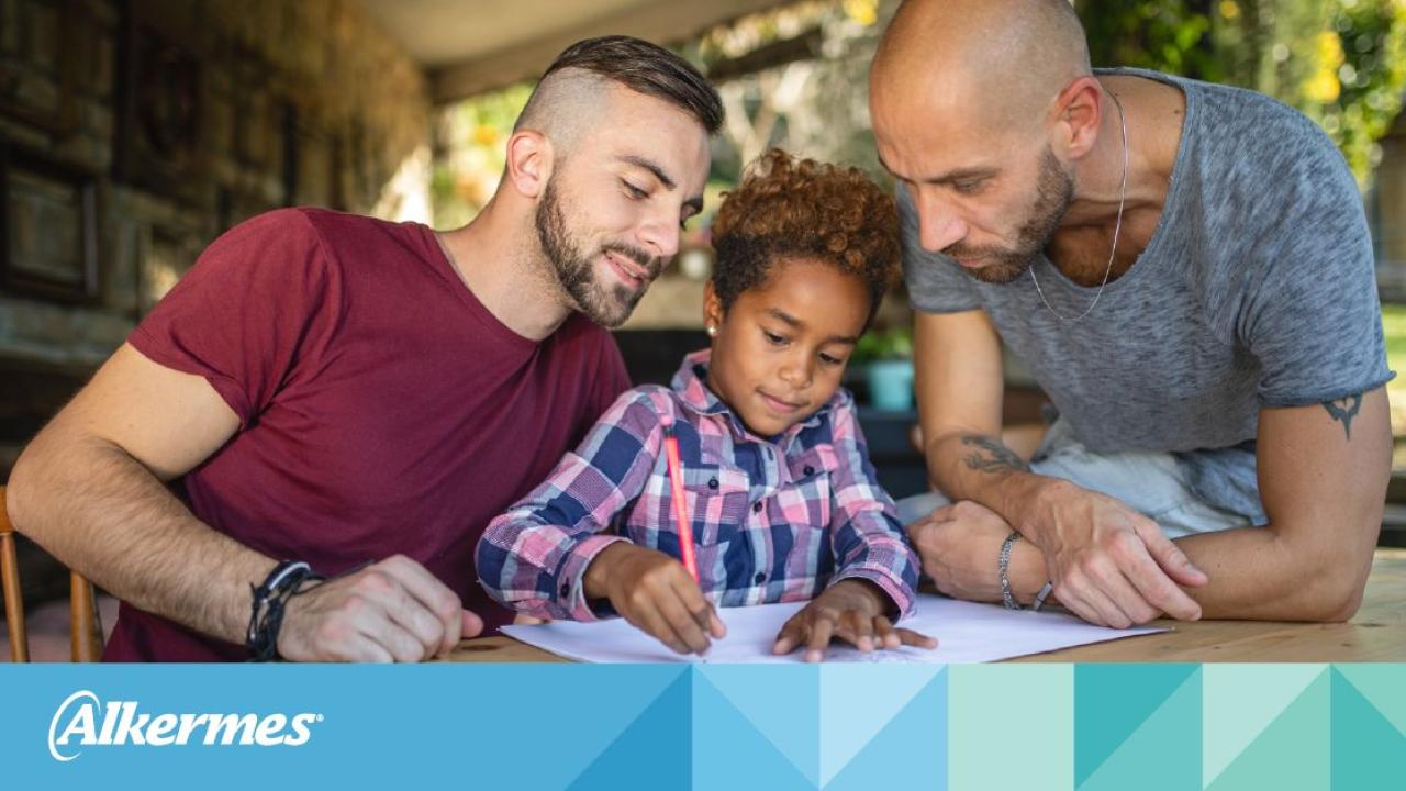 family with a child writing and the Alkermes logo