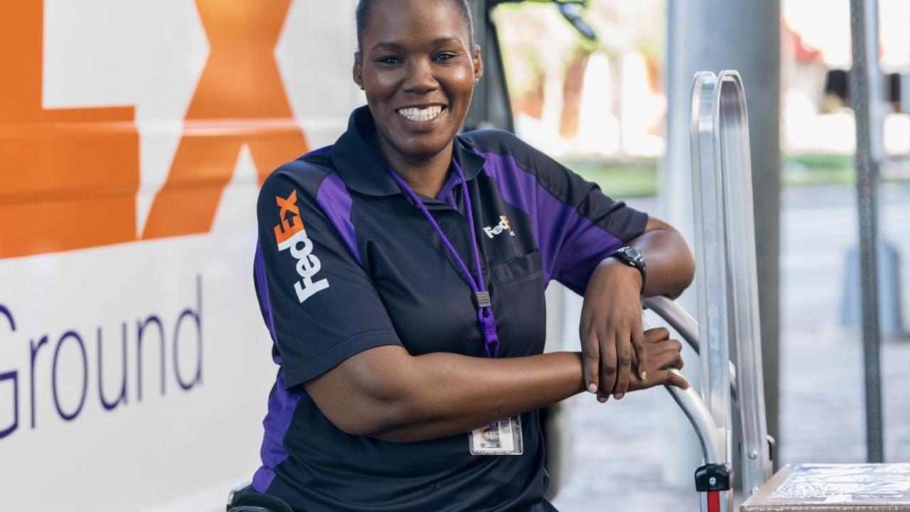 smiling FedEx employee