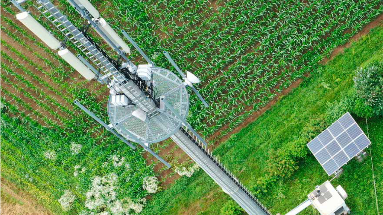 aerial view of cell tower in a field of crops