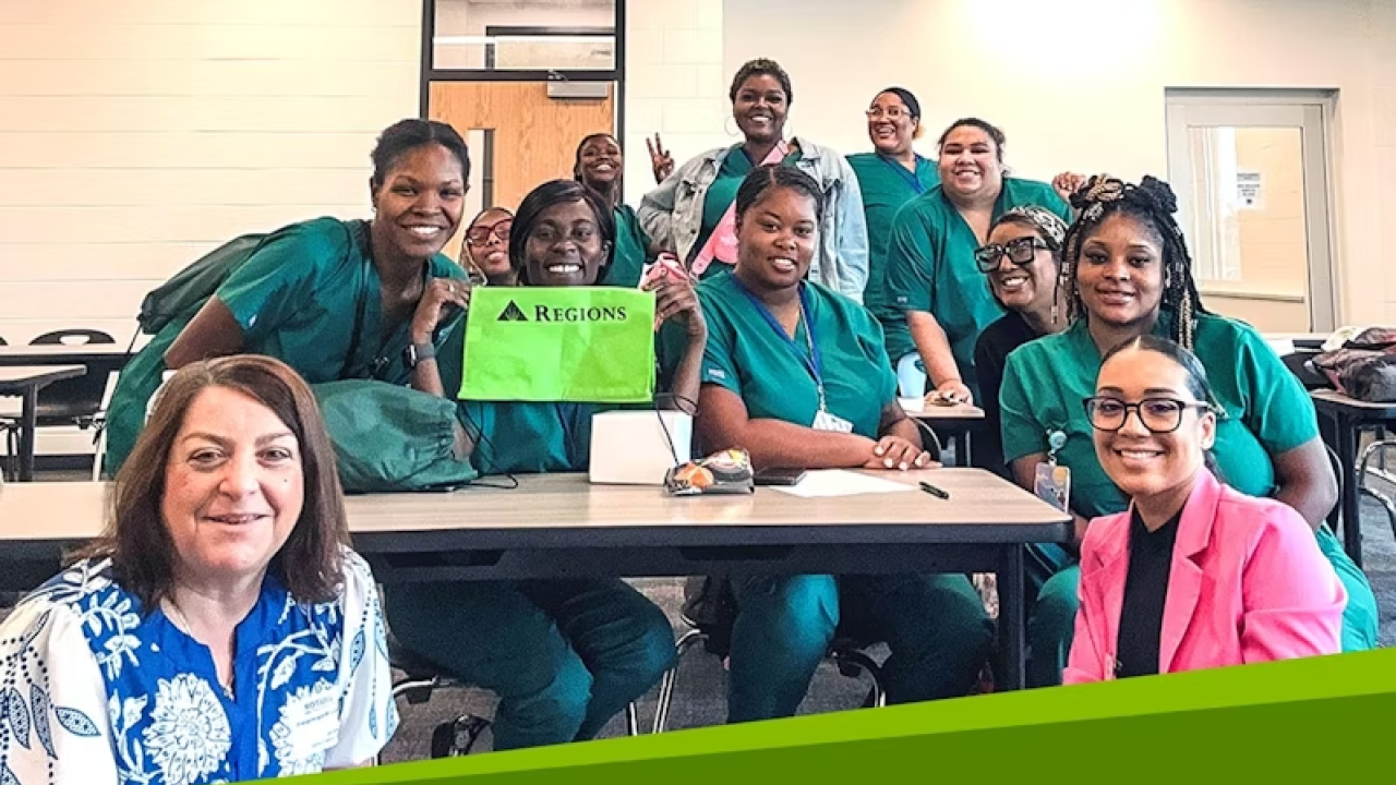 A group smiling in a classroom