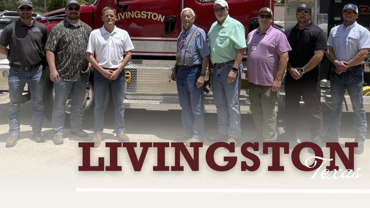 Group from the Livingston fire department standing by fire truck
