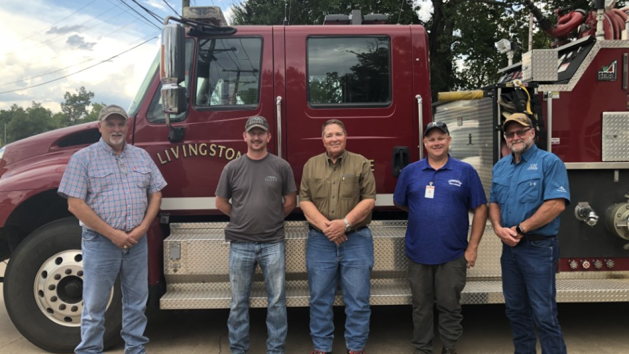 4 Livingston firefighters in front of truck