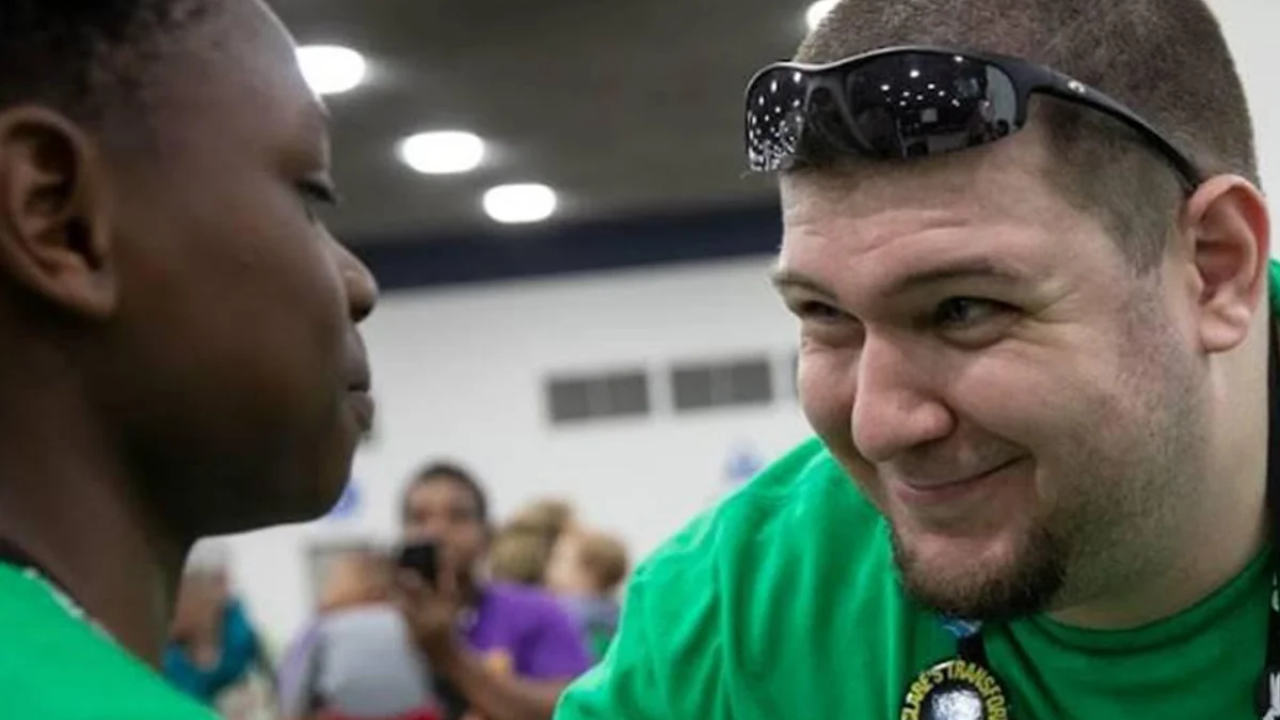 A FIRST mentor encourages a student