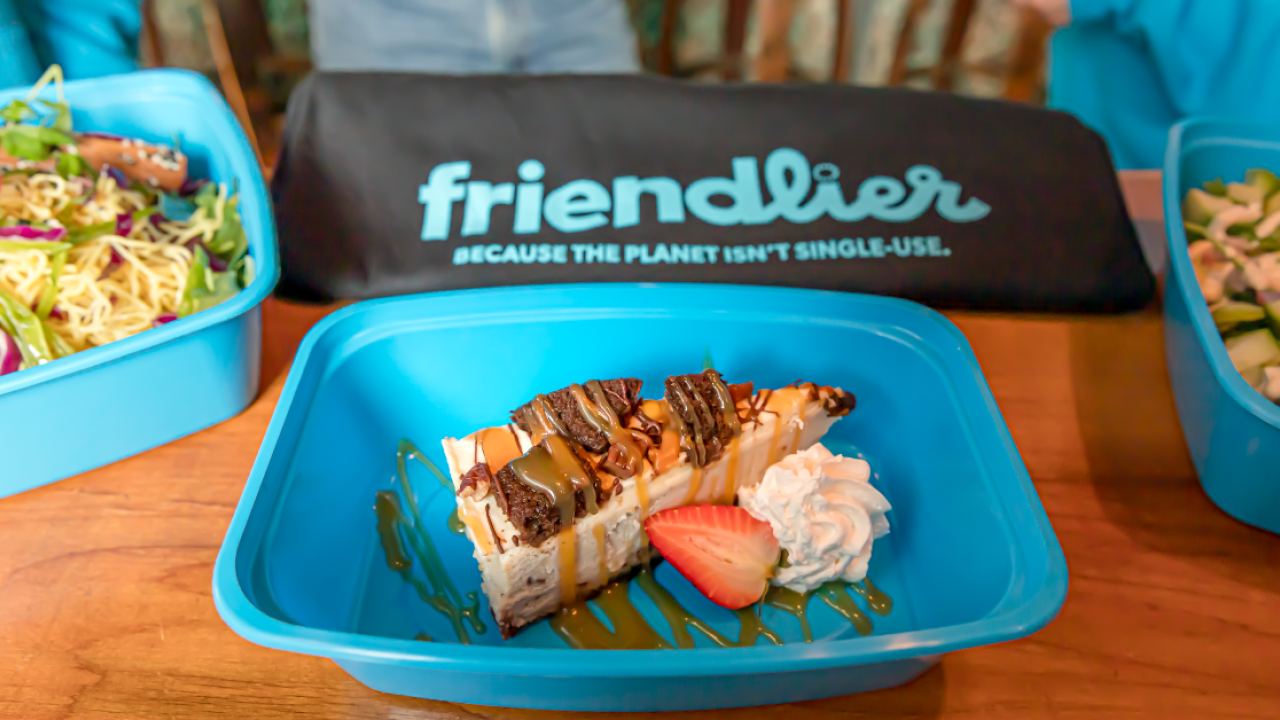 three friendlier containers with food in them, a 'friendlier' bag behind them