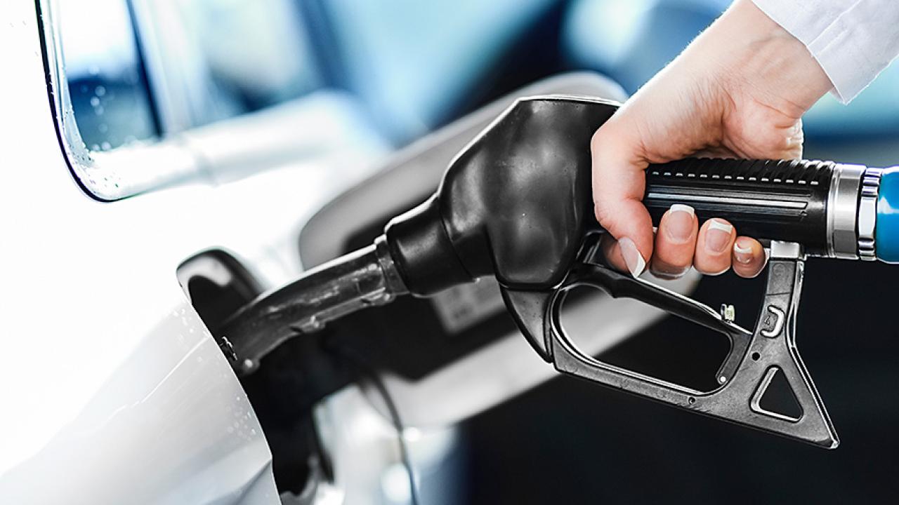a person pumping fuel into their vehicle