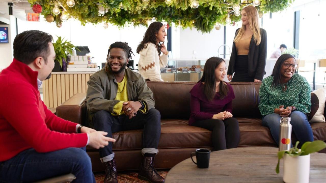 Diverse group of people sitting together and talking