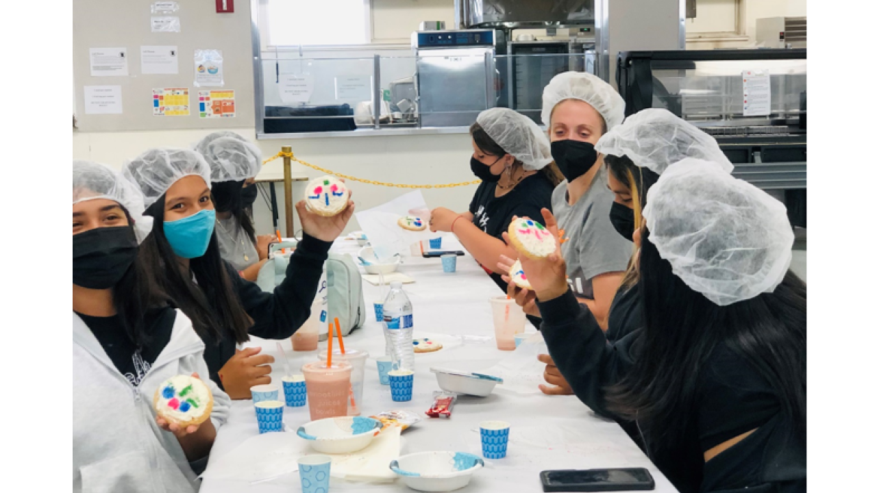 young scientists at work wearing full masks and protection