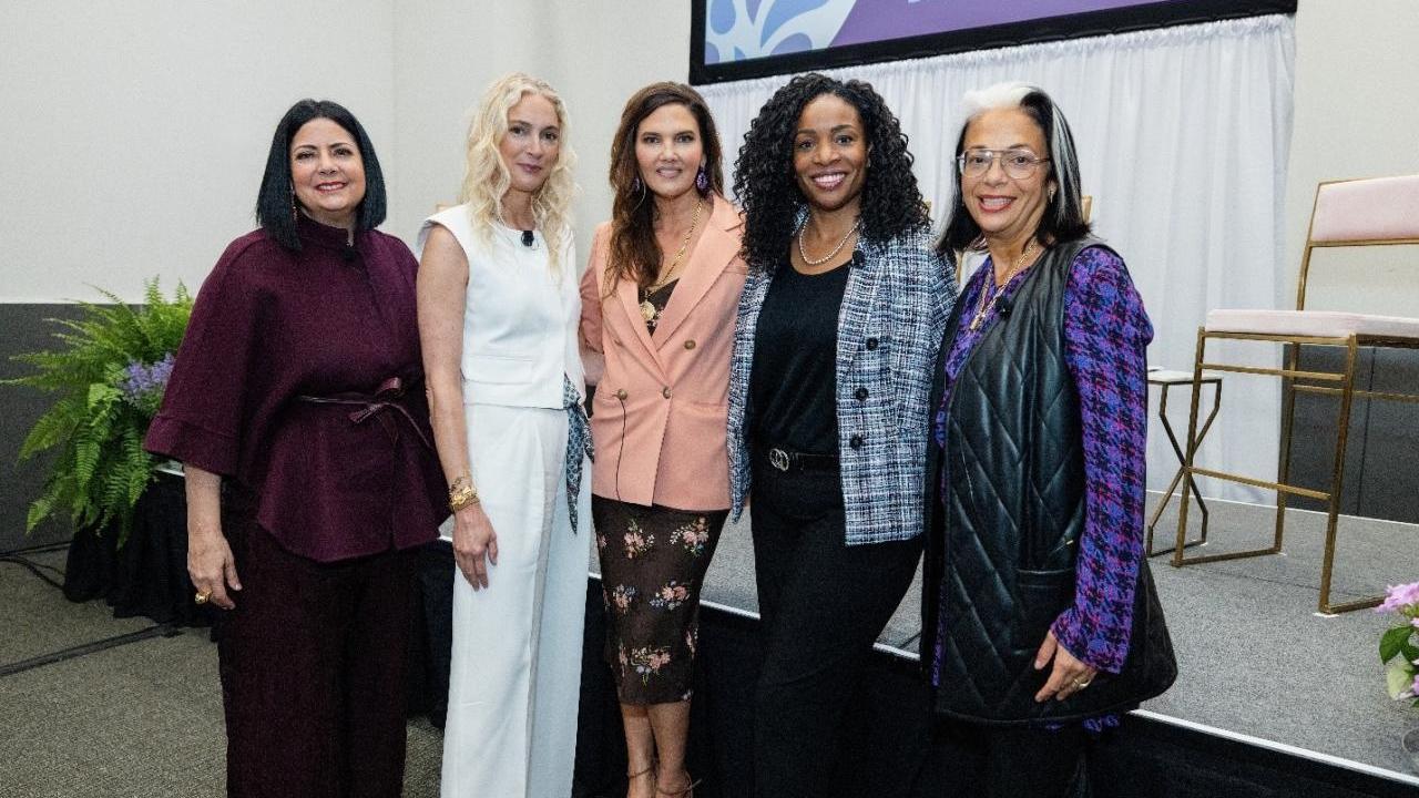 Five women standing together