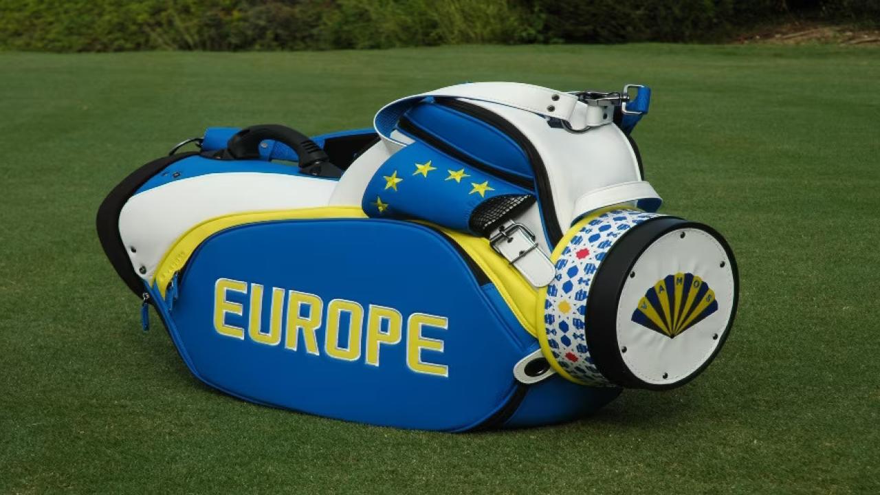 Golf club bag on its side on green grass. "Europe" on the side.