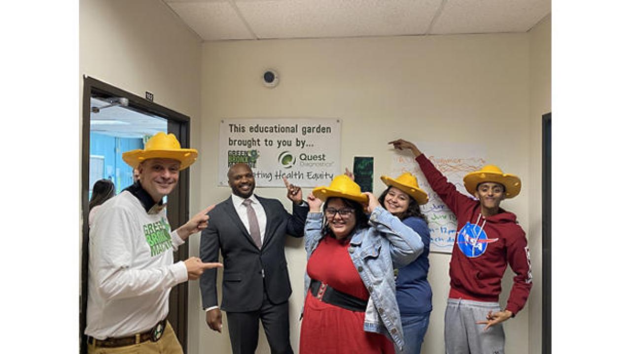 students being silly wearing straw hats