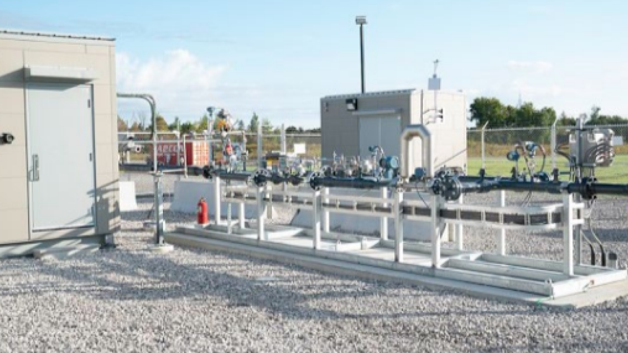 exterior energy building with industrial piping and gravel ground covering