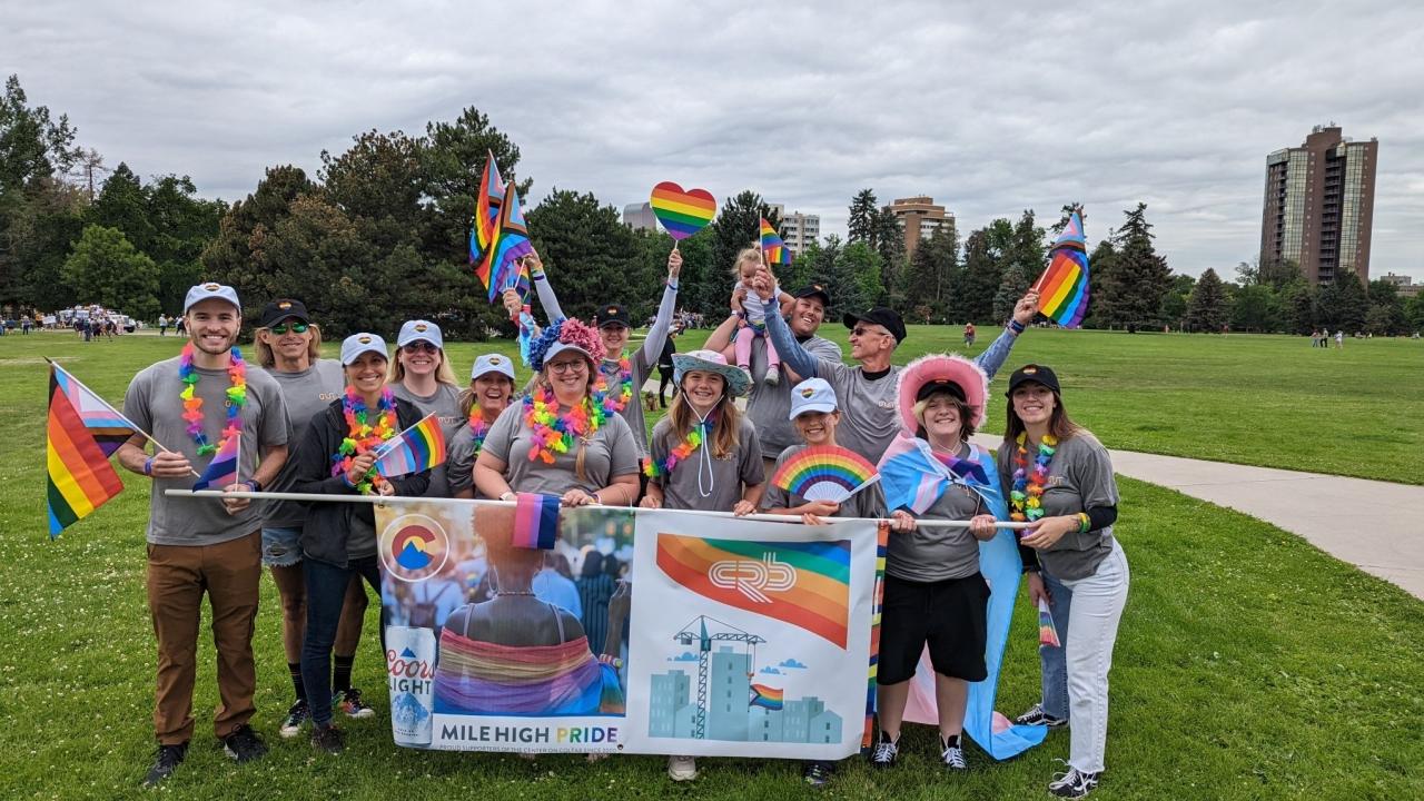 group picture with rainbow flags