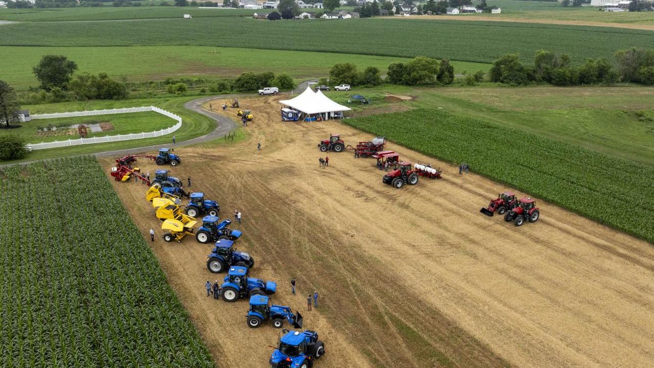 Aerial view of tractors and a tent