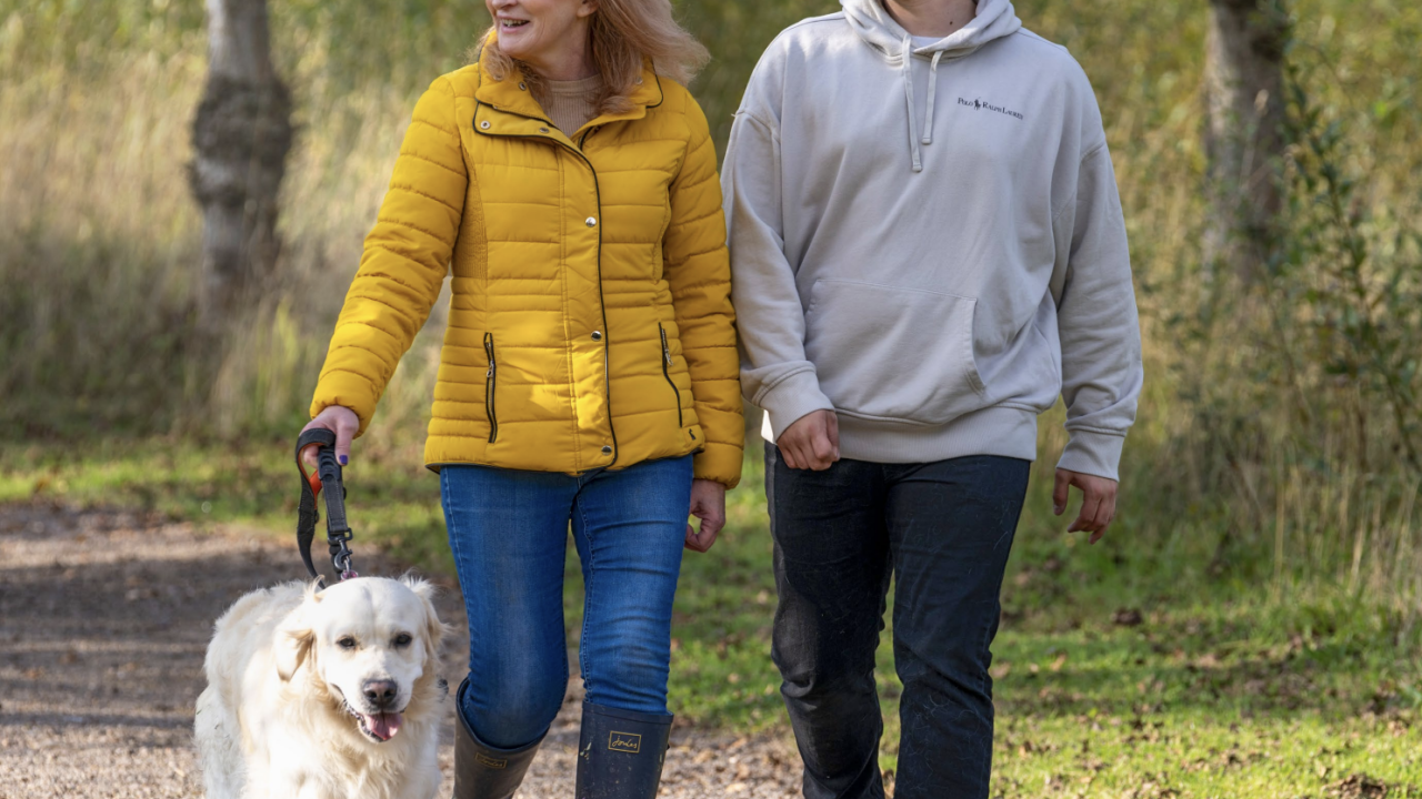 Family out walking dog