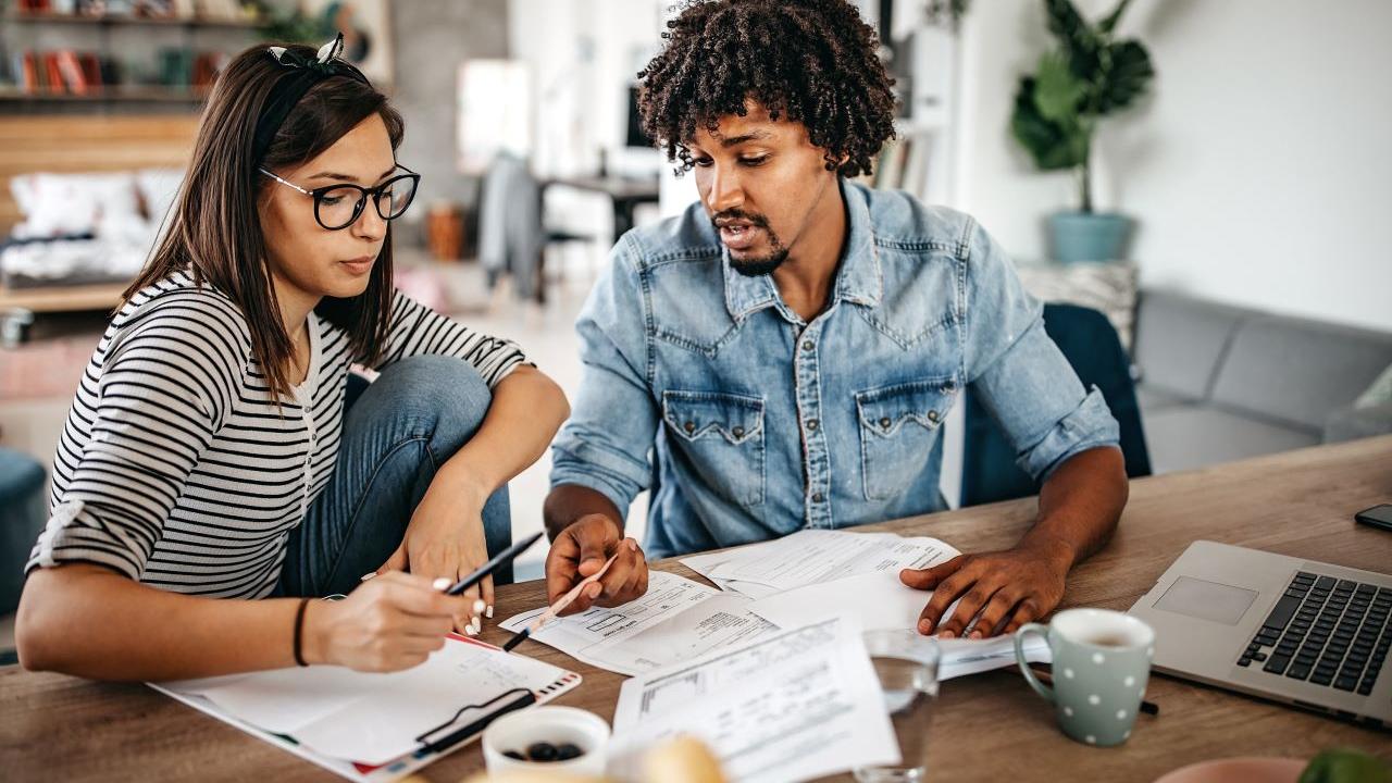 people working on bills together