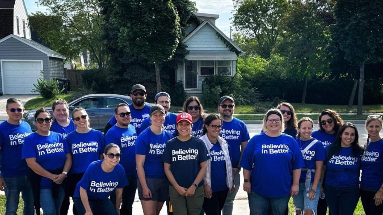 volunteers in blue Kohler t-shirts