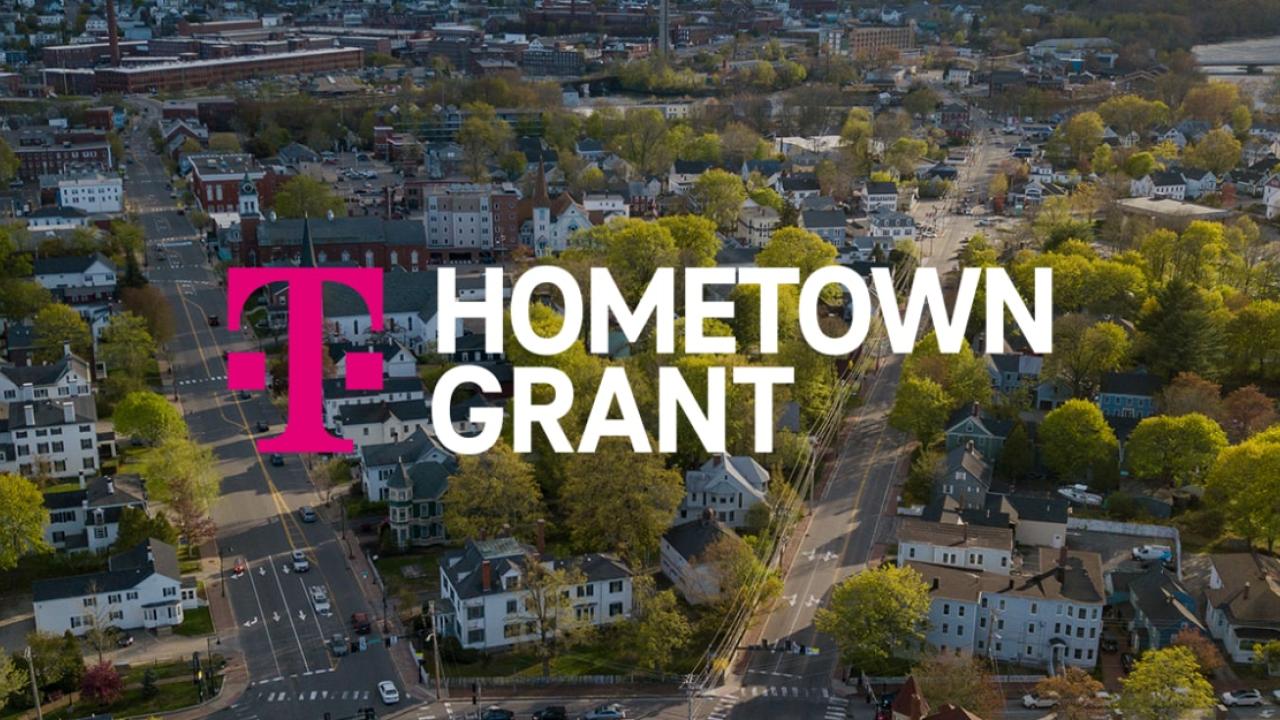 Aerial view of a residential area, Tmobile logo and "Hometown Grant" on the foreground.