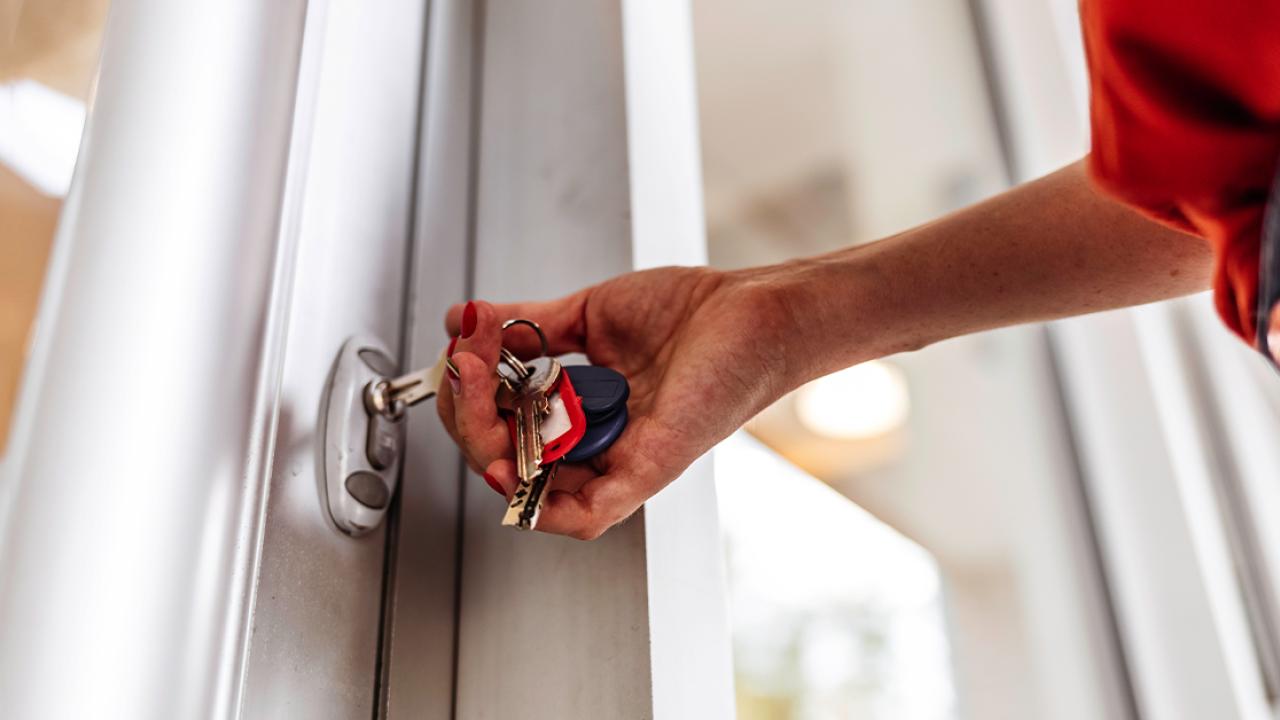 Hand on a door knob. 