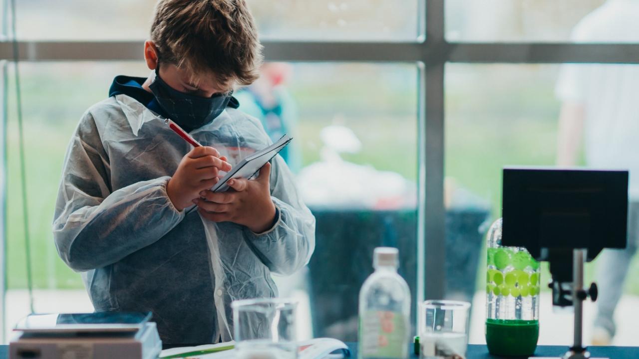 Student in front of lab equipment