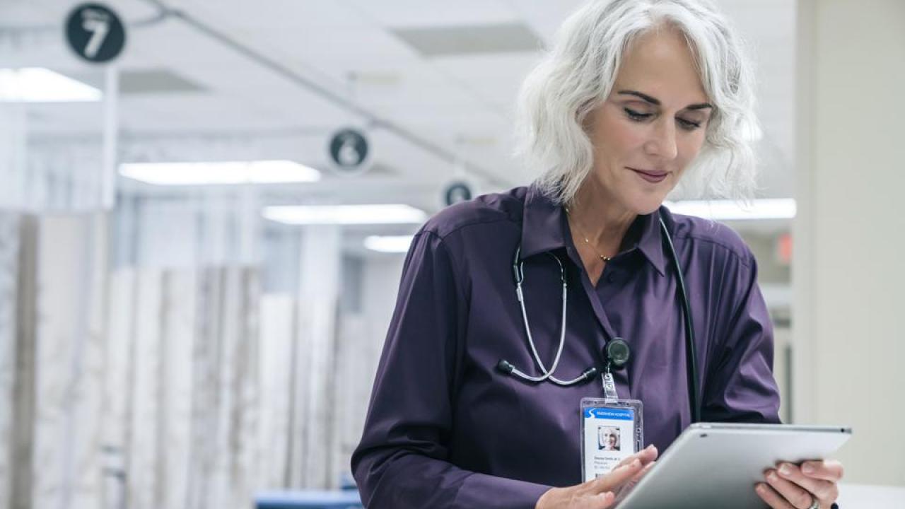 Doctor reading a tablet