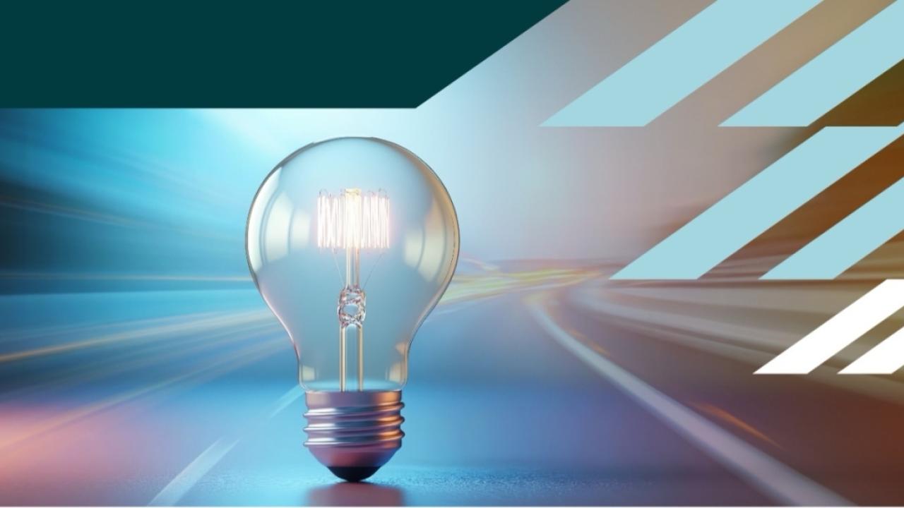 Illuminated lightbulb on a graphic background