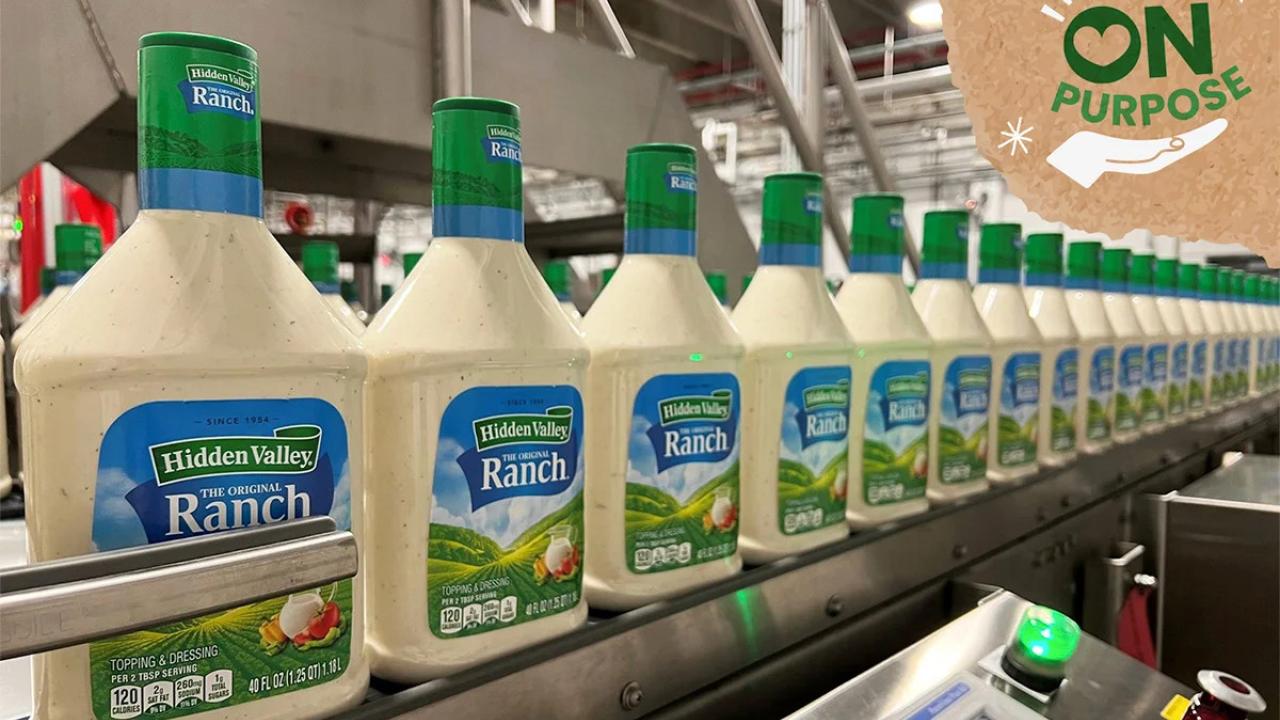 Bottles of Ranch dressing on a conveyor line