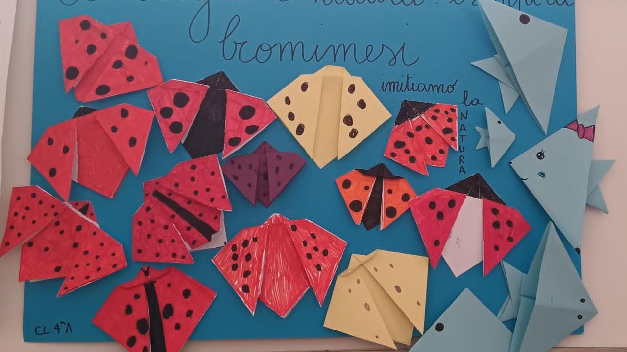 A paper poster with various handmade animals
