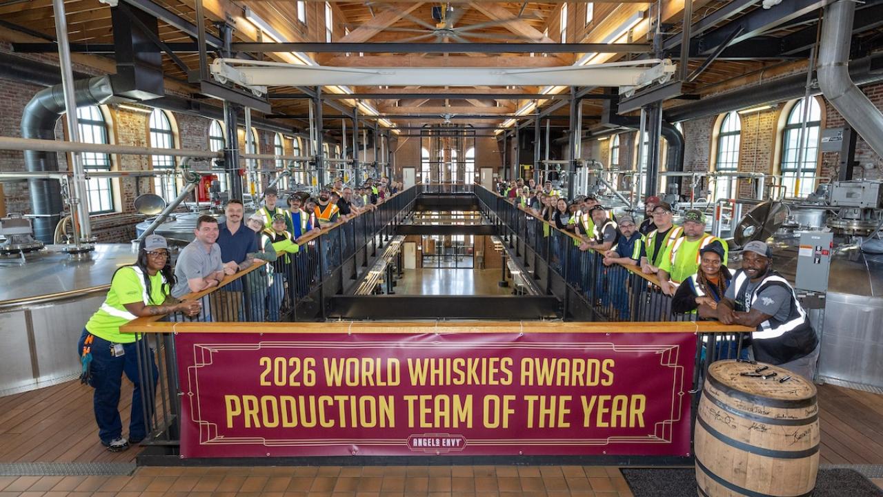 employees holding up award banner